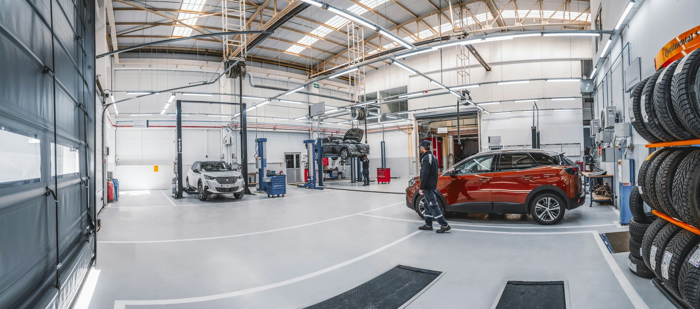 KAKA Group service workshop with vehicles on lifts
