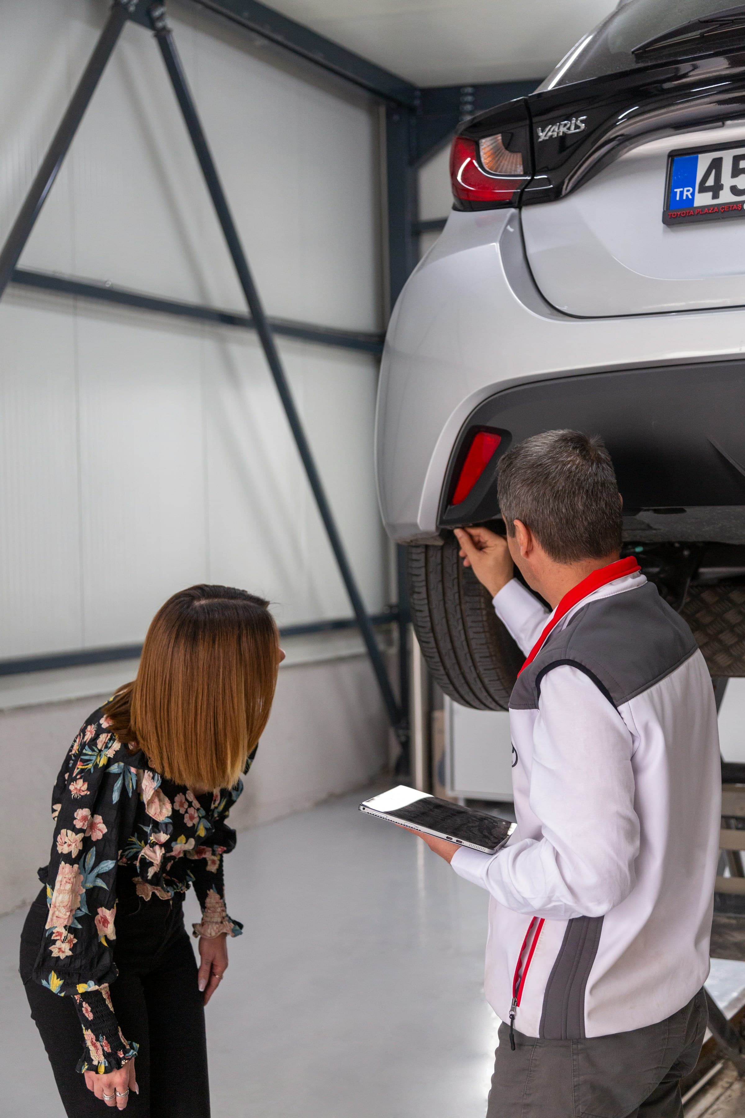 Vehicle inspected on a lift before shipment