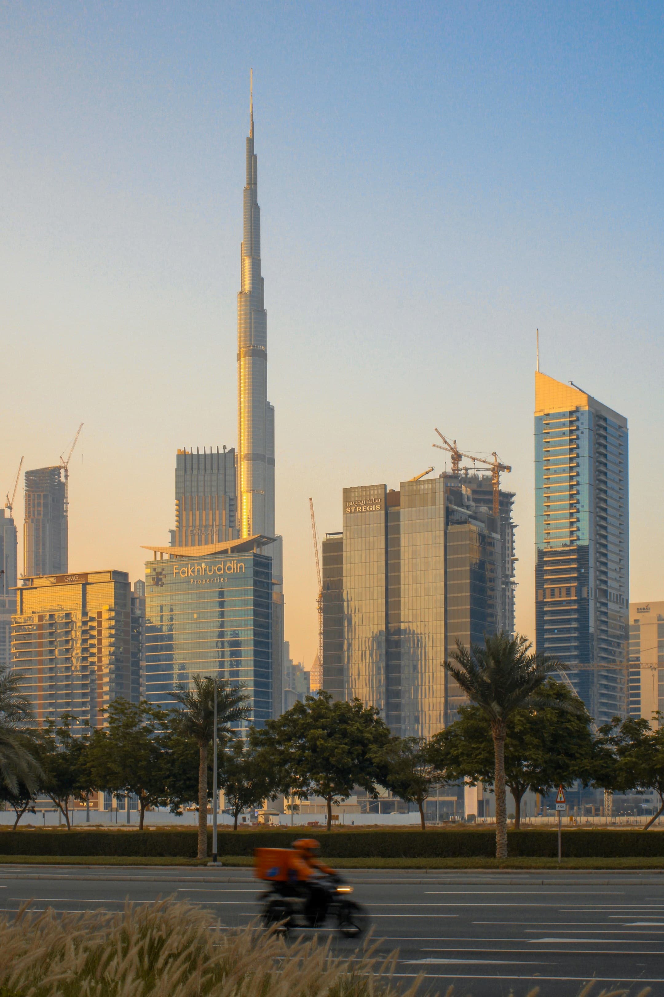 Delivery rider on a Dubai arterial road